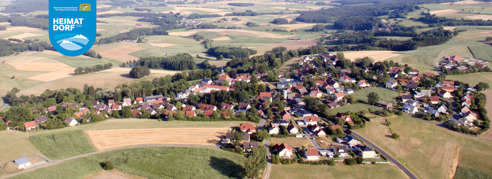 Slider Emtmannsberg mit Heimatdorflogo